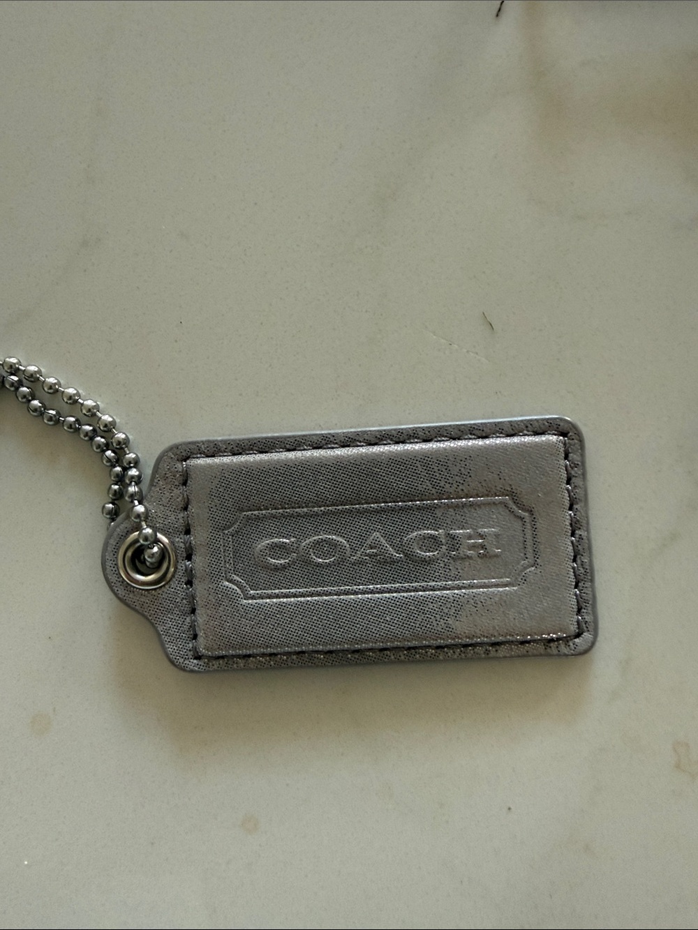 Coach Hang Tag